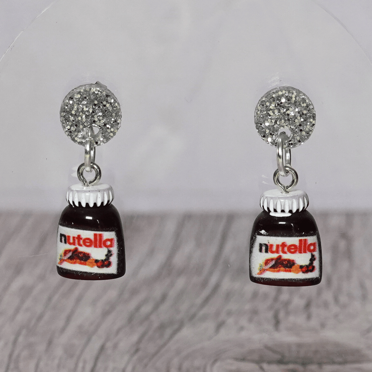 Novelty dangle earrings shaped like small chocolate hazelnut spread jars with white lids
