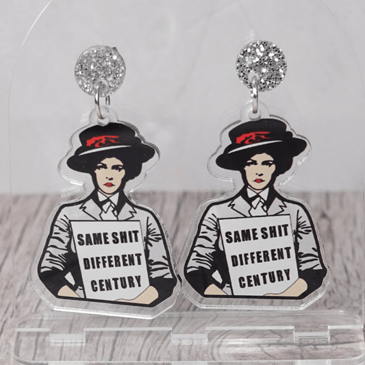 Funny acrylic dangle earrings featuring a vintage-style woman holding a sign that reads “Same shit different century.”