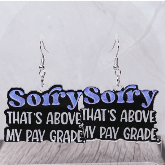 Black novelty dangle earrings with text “sorry that’s above my pay grade”