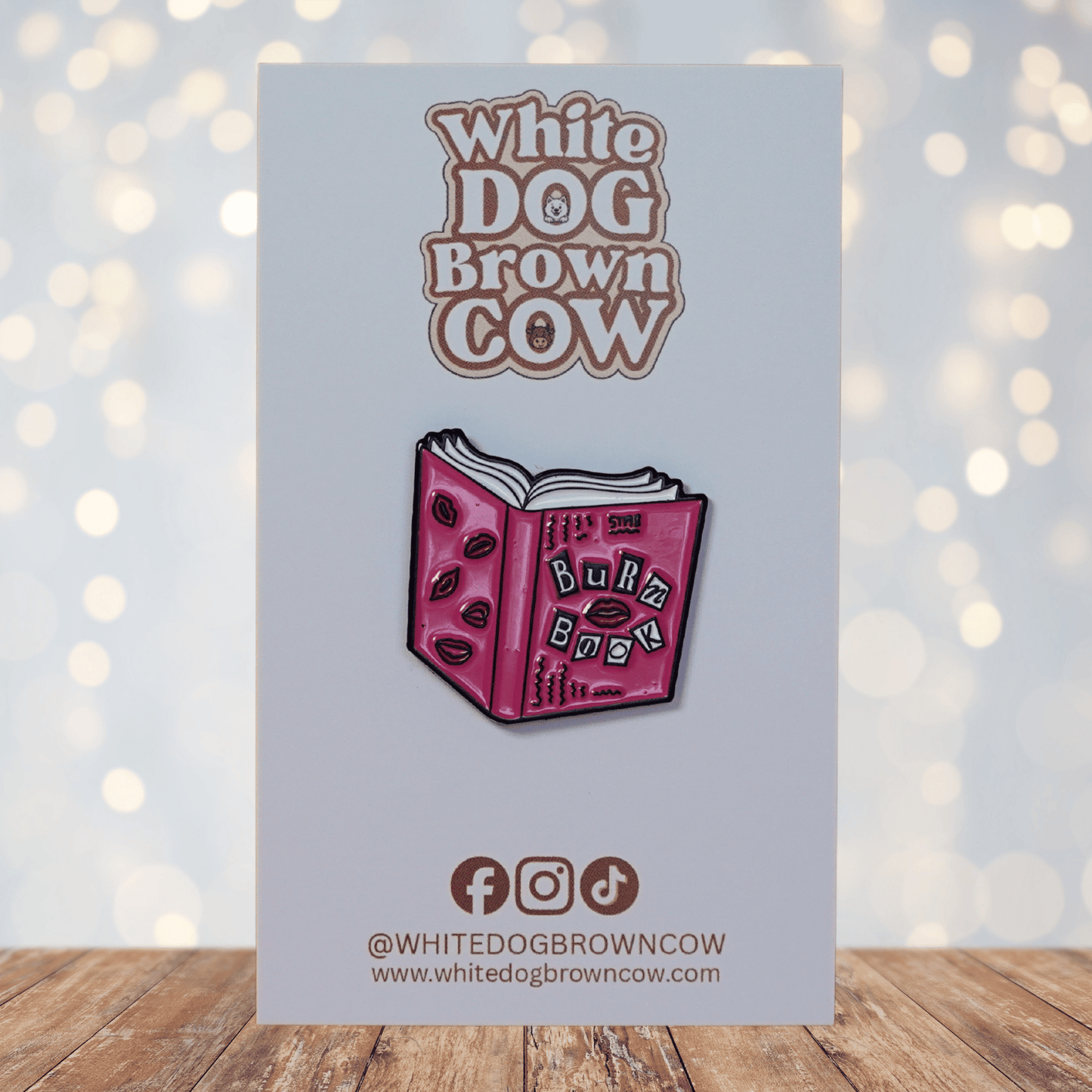 Funny pink “Burn Book” style enamel pin with lips and book design