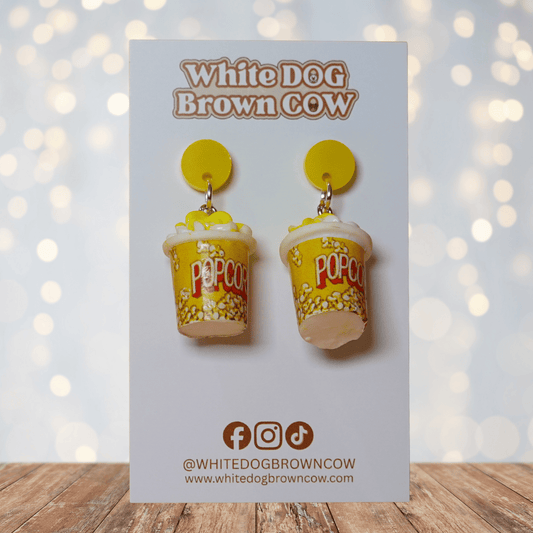 Yellow popcorn bucket shaped dangle earrings filled with popcorn and yellow stud tops