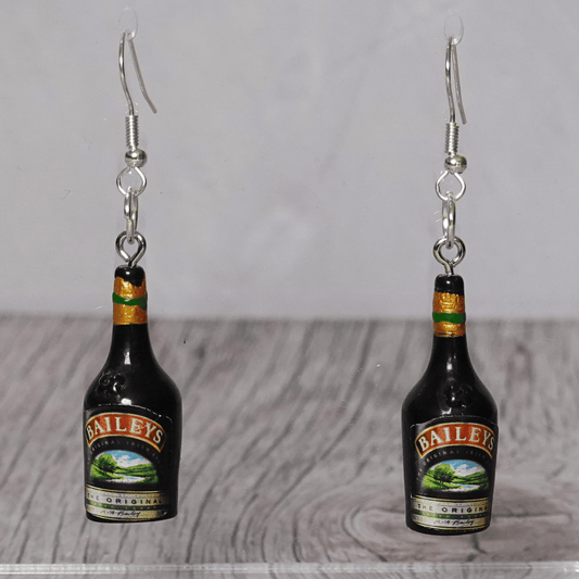 Mini Irish cream liqueur bottle shaped dangle earrings with dark bottle design and silver hooks.
