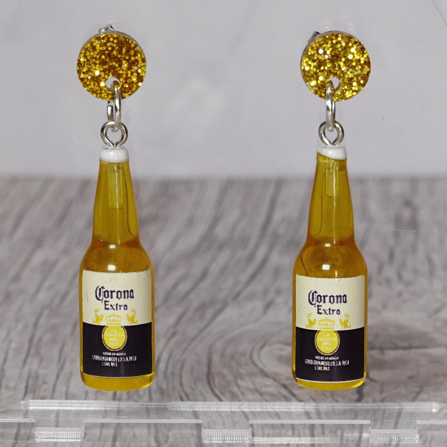 Novelty dangle earrings shaped like small beer bottles