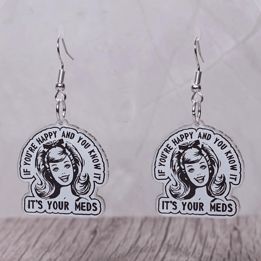 Black and white retro style earrings with woman illustration and text “If you’re happy and you know it it’s your meds”