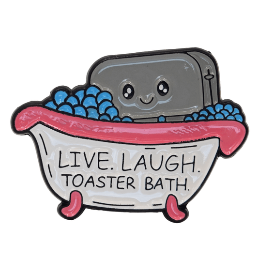 Funny dark humor enamel pin of smiling toaster in a bubble bath with text “live laugh toaster bath,” sarcastic novelty meme pin