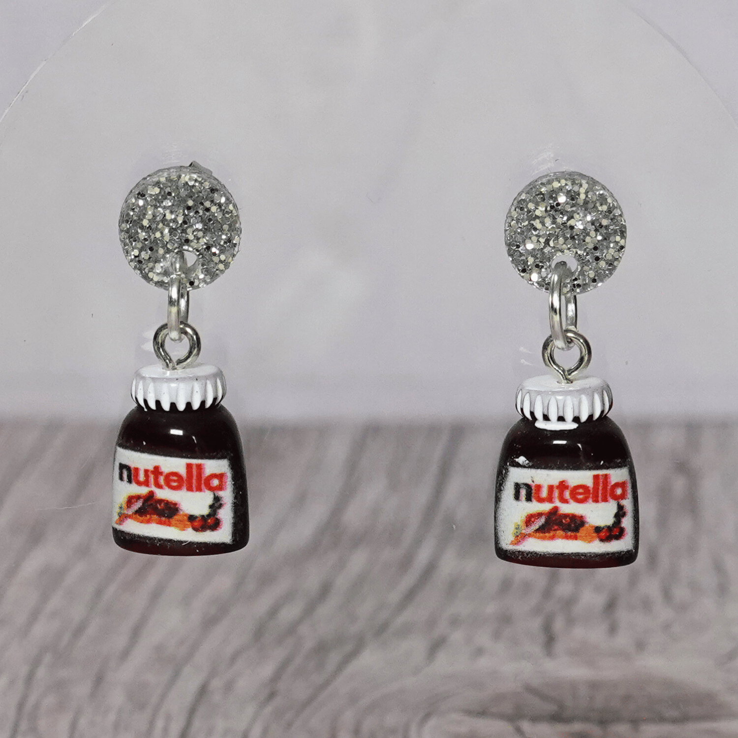 Novelty dangle earrings shaped like small chocolate hazelnut spread jars with white lids