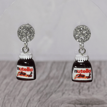 Novelty dangle earrings shaped like small chocolate hazelnut spread jars with white lids
