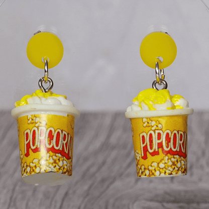 Yellow popcorn bucket shaped dangle earrings filled with popcorn and yellow stud tops