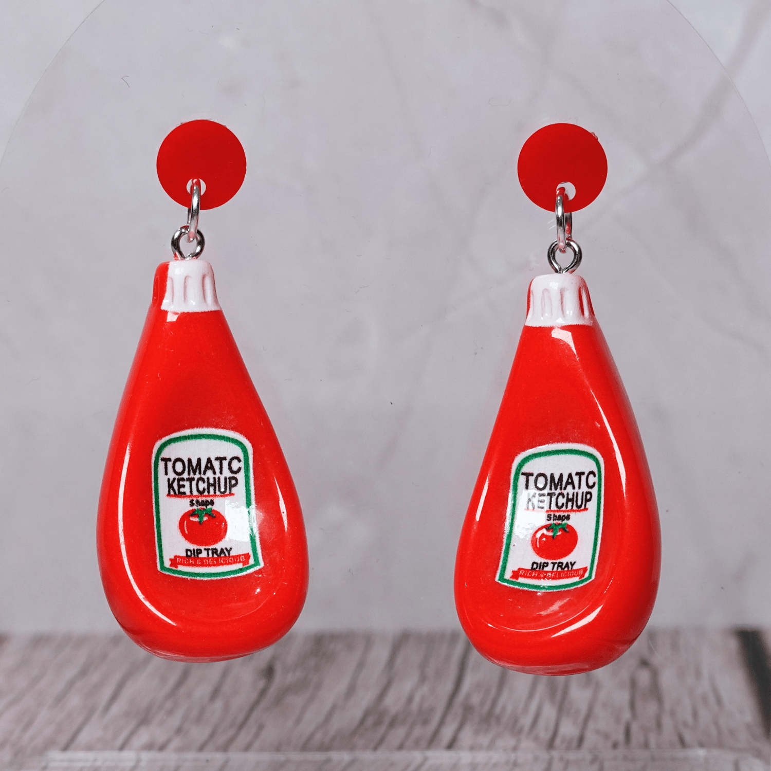 Red tomato ketchup bottle shaped dangle earrings with white cap and red stud tops