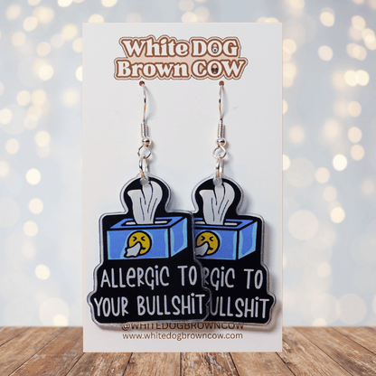 Acrylic dangle earrings shaped like a tissue box with text reading “Allergic to your bullshit”