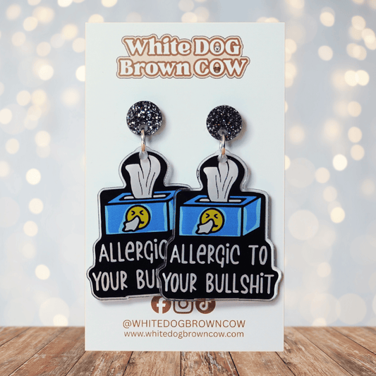 Acrylic dangle earrings shaped like a tissue box with text reading “Allergic to your bullshit”