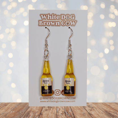 Novelty dangle earrings shaped like small beer bottles