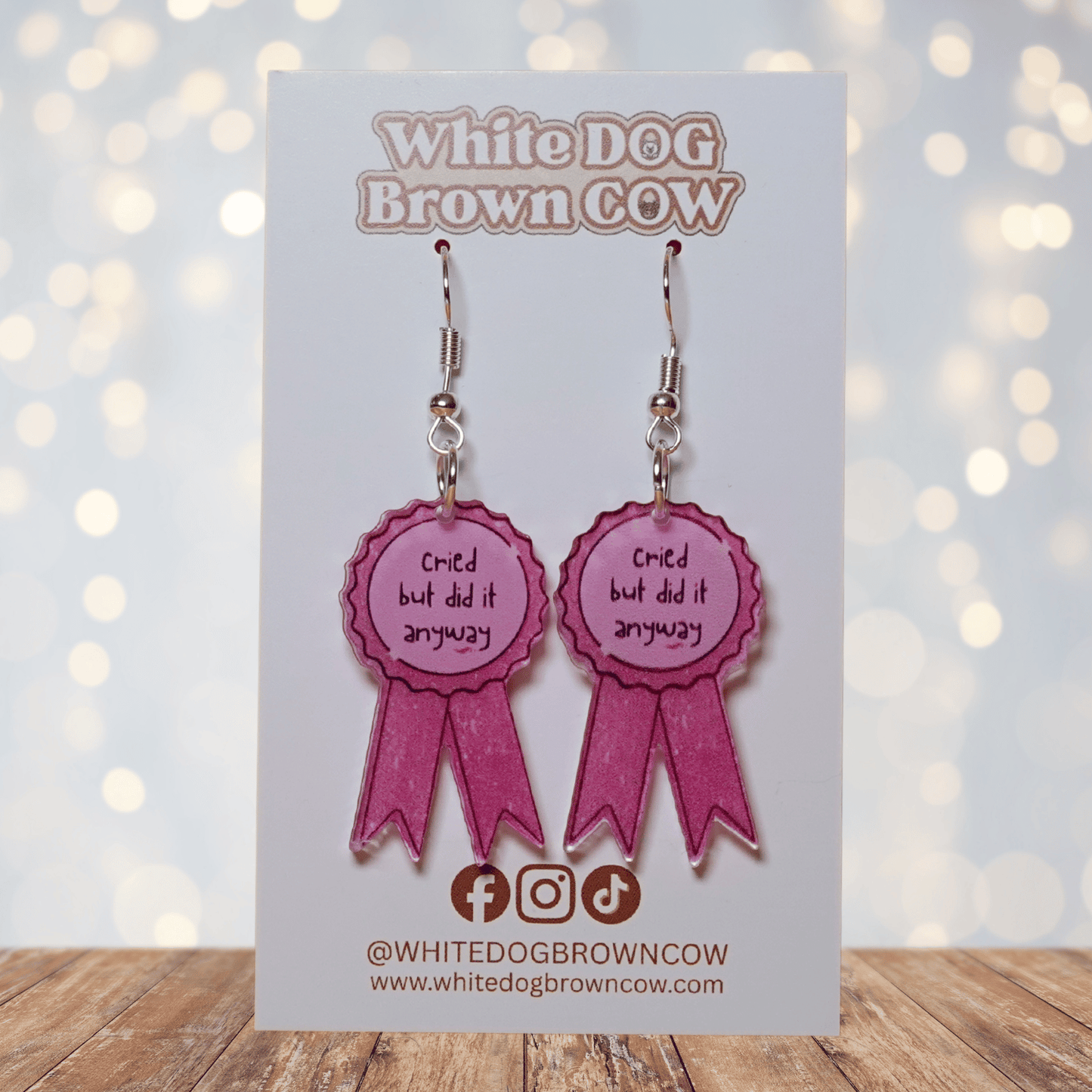 Pink award ribbon dangle earrings with text “cried but did it anyway”