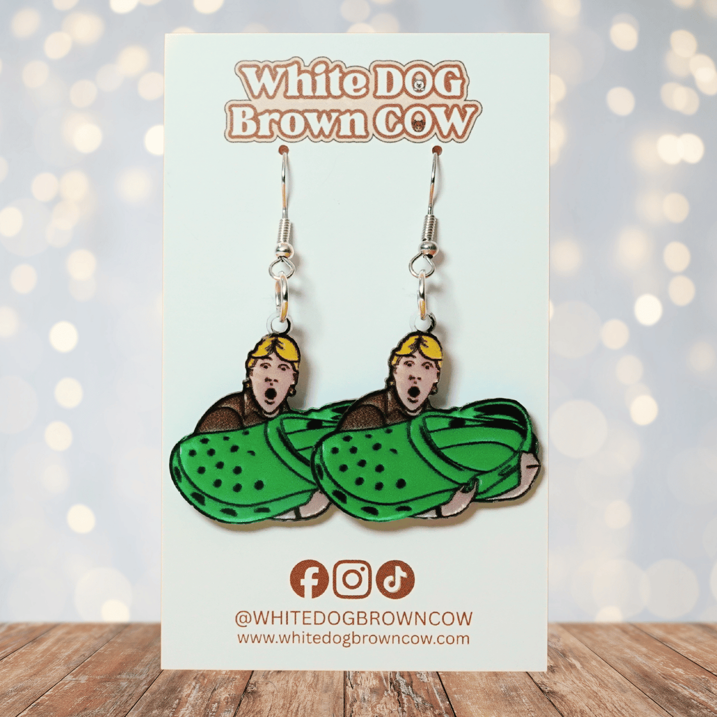 Novelty dangle earrings showing Steve Irwin holding an oversized green clog shoe