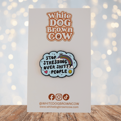 Funny sarcastic Stop Stressing Over Shitty People enamel pin with rainbow, heart, and smiley face