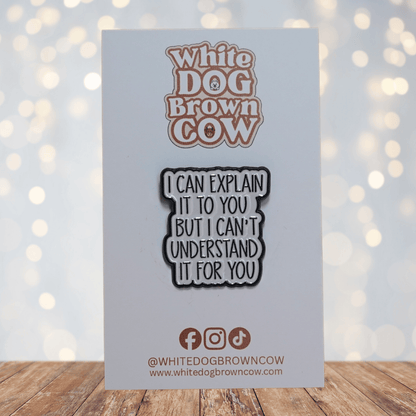 Enamel pin with the quote “I can explain it to you but I can’t understand it for you” in black text on a light background.