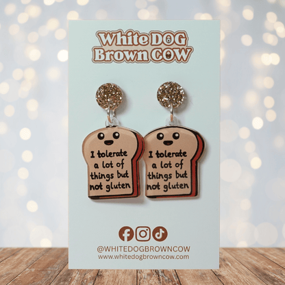 Acrylic dangle earrings shaped like a slice of bread with text reading “I tolerate a lot of things but not gluten”