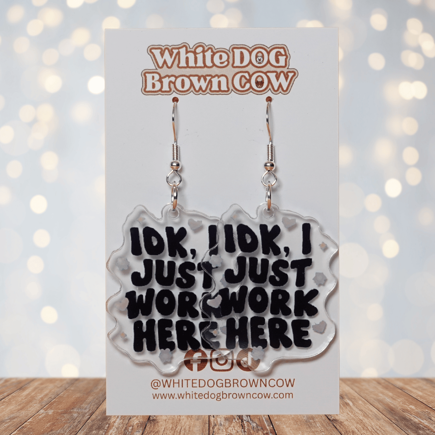 Clear acrylic dangle earrings with the phrase “IDK, I just work here” in bold black lettering