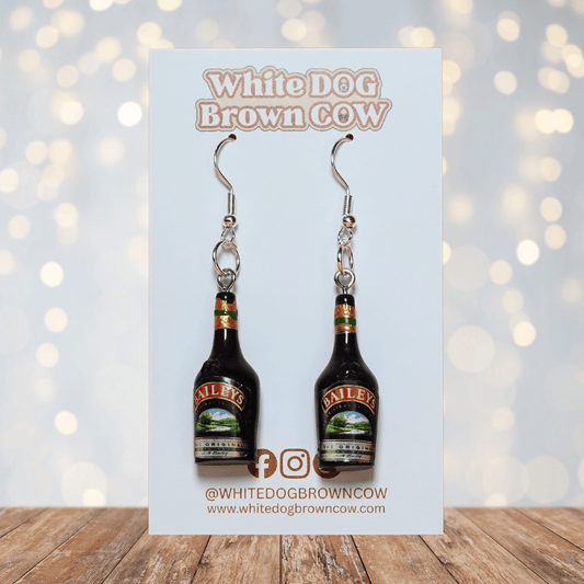 Mini Irish cream liqueur bottle shaped dangle earrings with dark bottle design and silver hooks.
