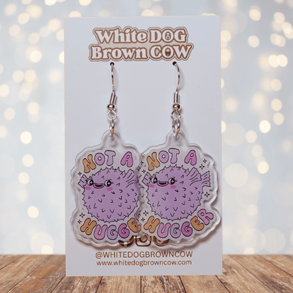 Cute pastel pufferfish dangle earrings with text “Not a Hugger”