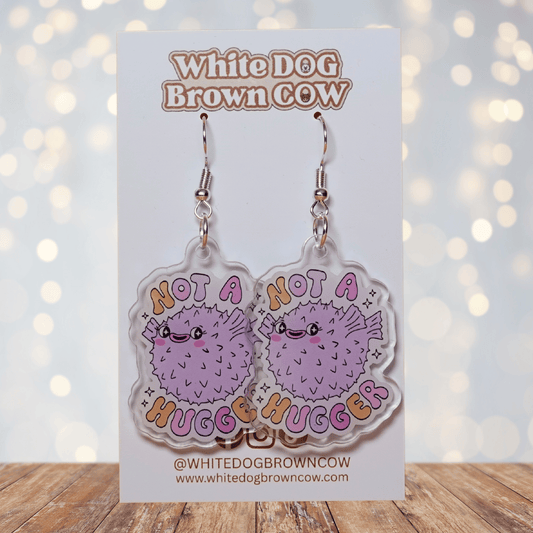 Cute pastel pufferfish dangle earrings with text “Not a Hugger”
