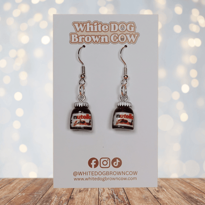Novelty dangle earrings shaped like small chocolate hazelnut spread jars with white lids