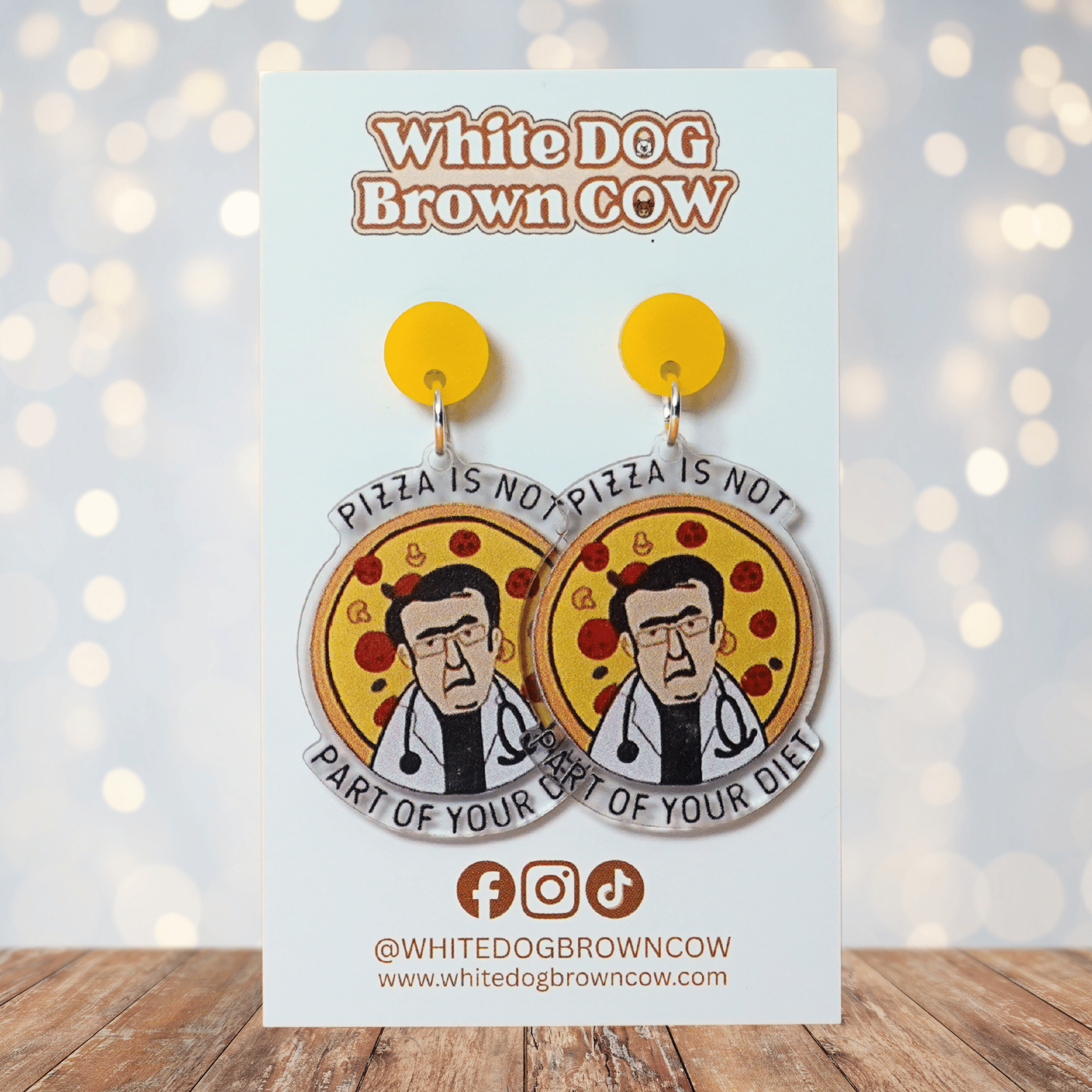 Funny acrylic dangle earrings showing Doctor Now from My 600lb Life in front of a pizza with the phrase “Pizza is not part of your diet.”