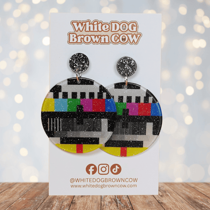 Round dangle earrings featuring a retro television test pattern with colorful bars and black and white graphics.