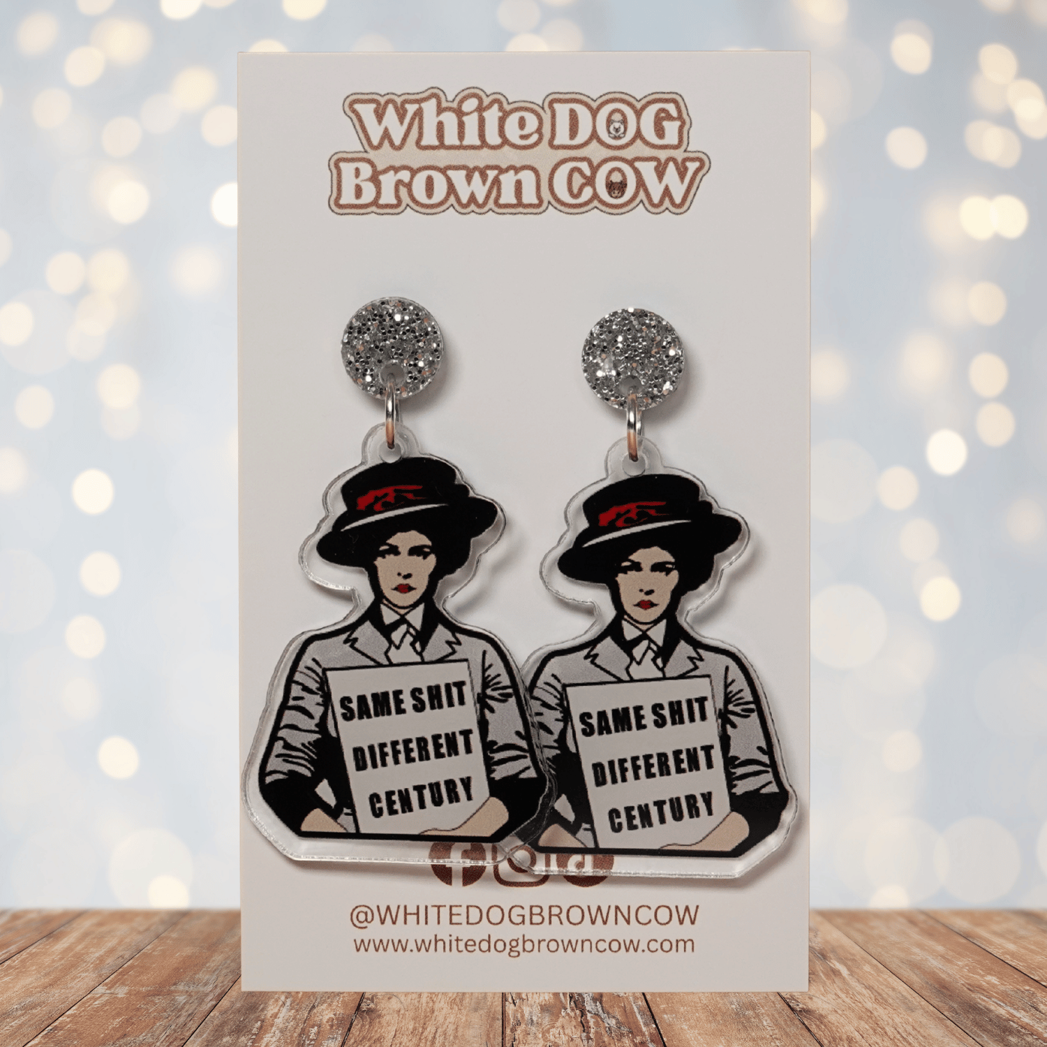 Funny acrylic dangle earrings featuring a vintage-style woman holding a sign that reads “Same shit different century.”