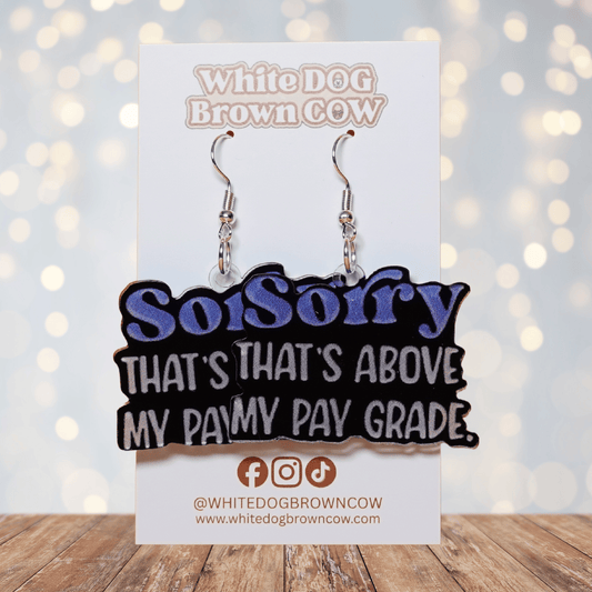 Black novelty dangle earrings with text “sorry that’s above my pay grade”
