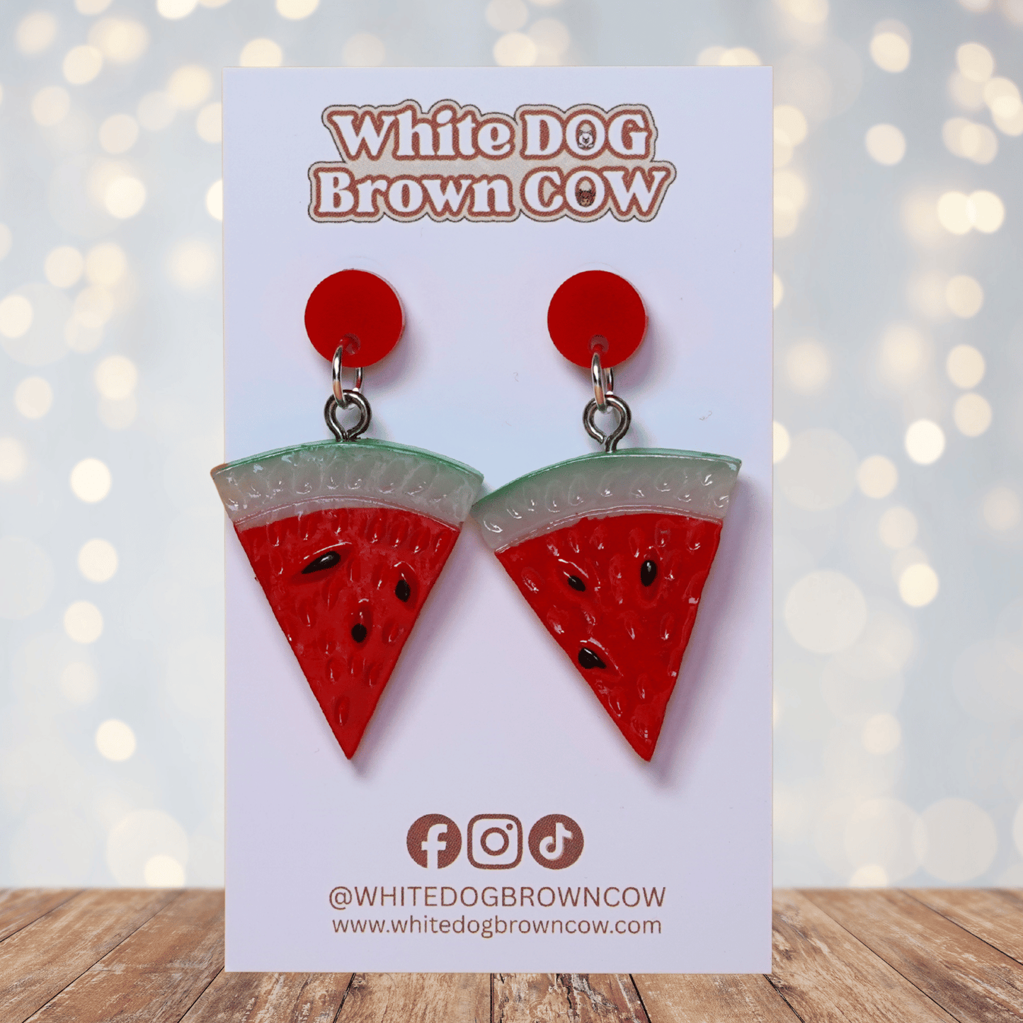 Watermelon slice dangle earrings shaped like red triangular watermelon pieces