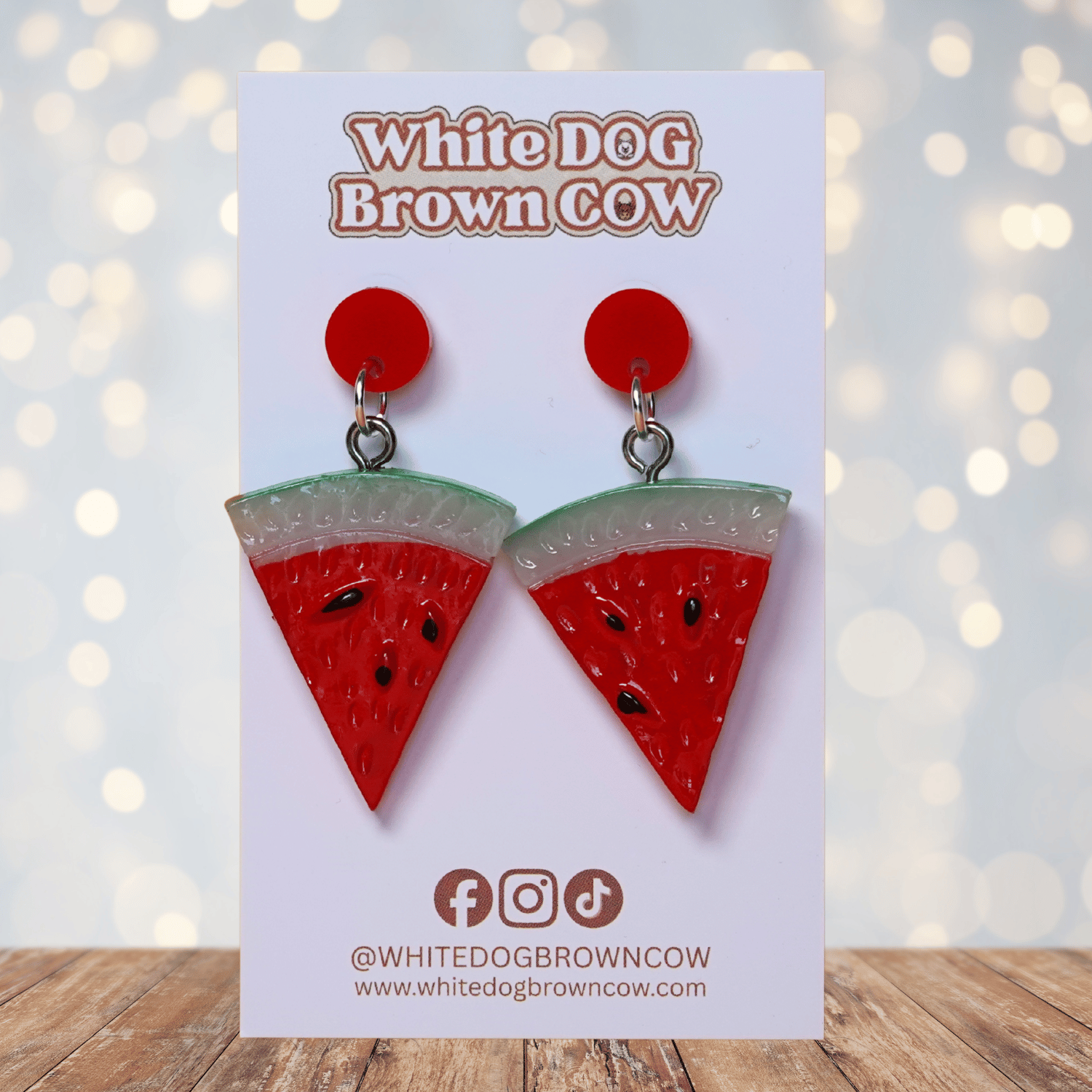 Watermelon slice dangle earrings shaped like red triangular watermelon pieces